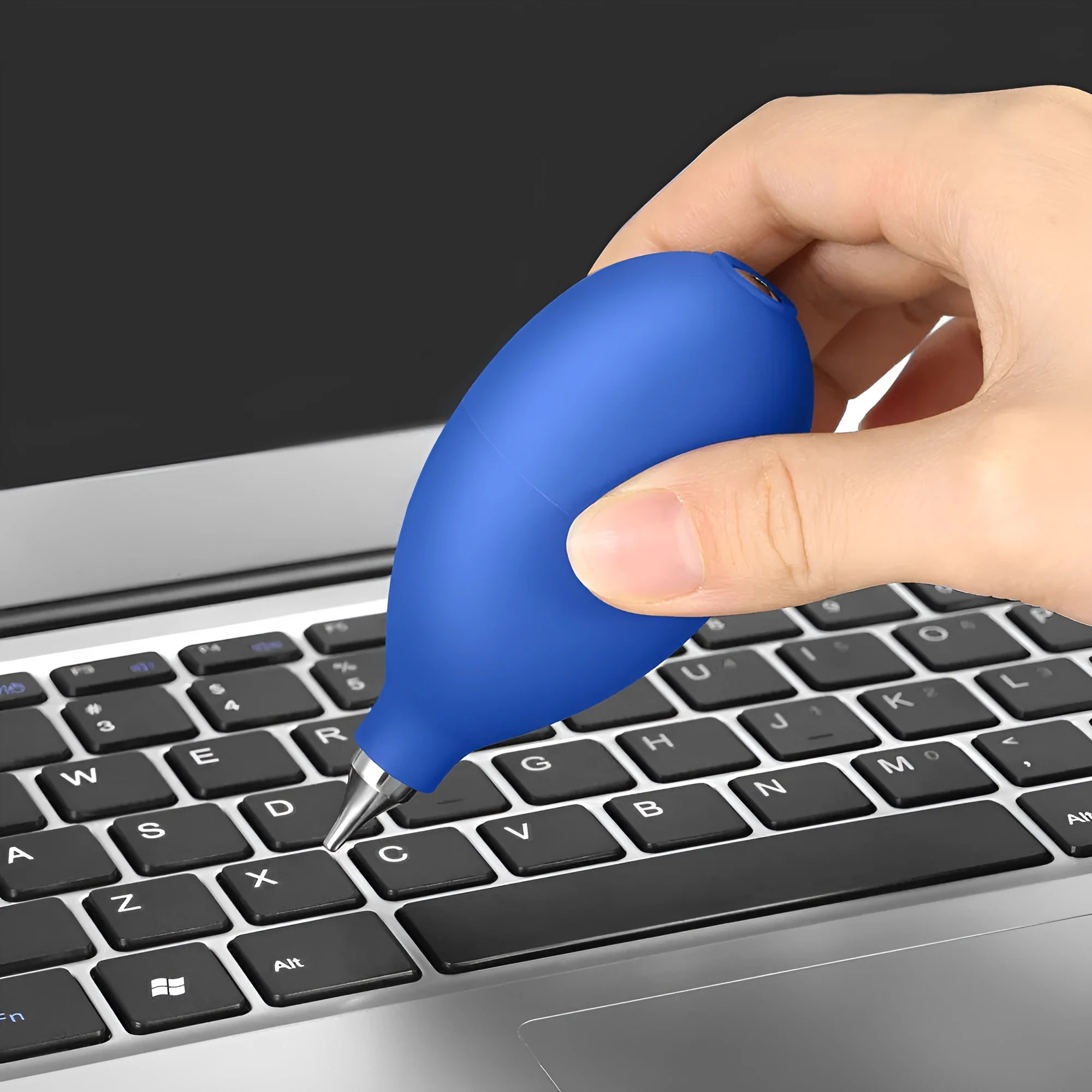 Blue and black rubber handheld dust removal ball for cleaning camera lenses and electronics.