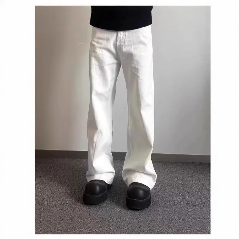 Men's white loose straight-leg cotton denim jeans with wide cut and zipper fly