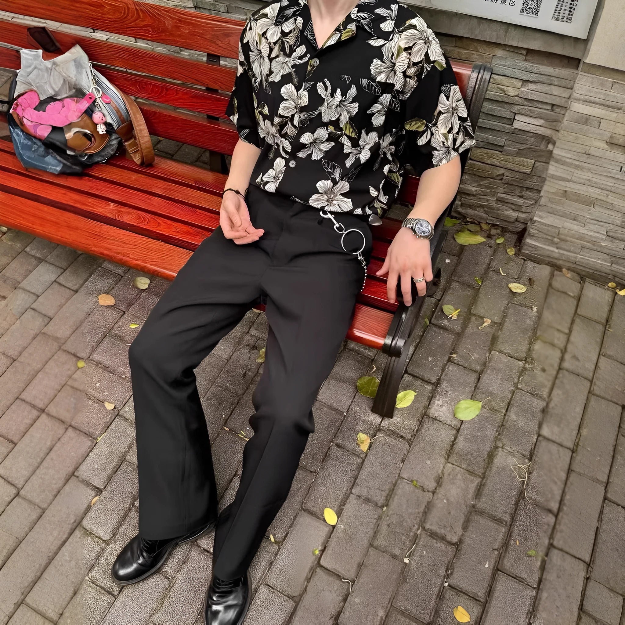 Black men's loose-fit ice silk shirt with vintage Cuban collar, short sleeves, and floral print.