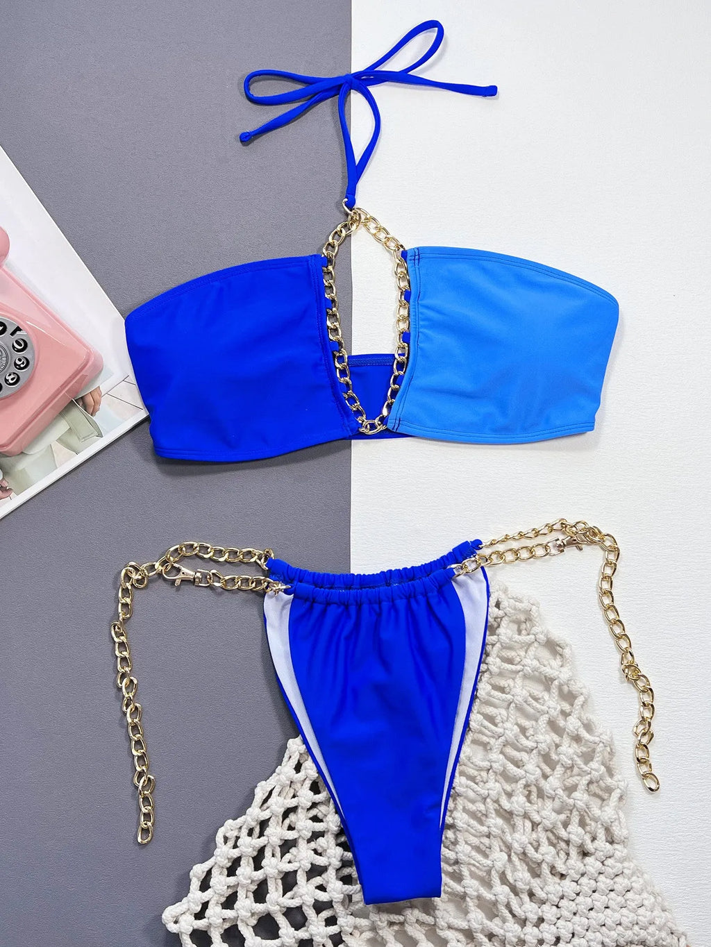 Solid blue women's nylon bikini swimsuit set on a hanger.
