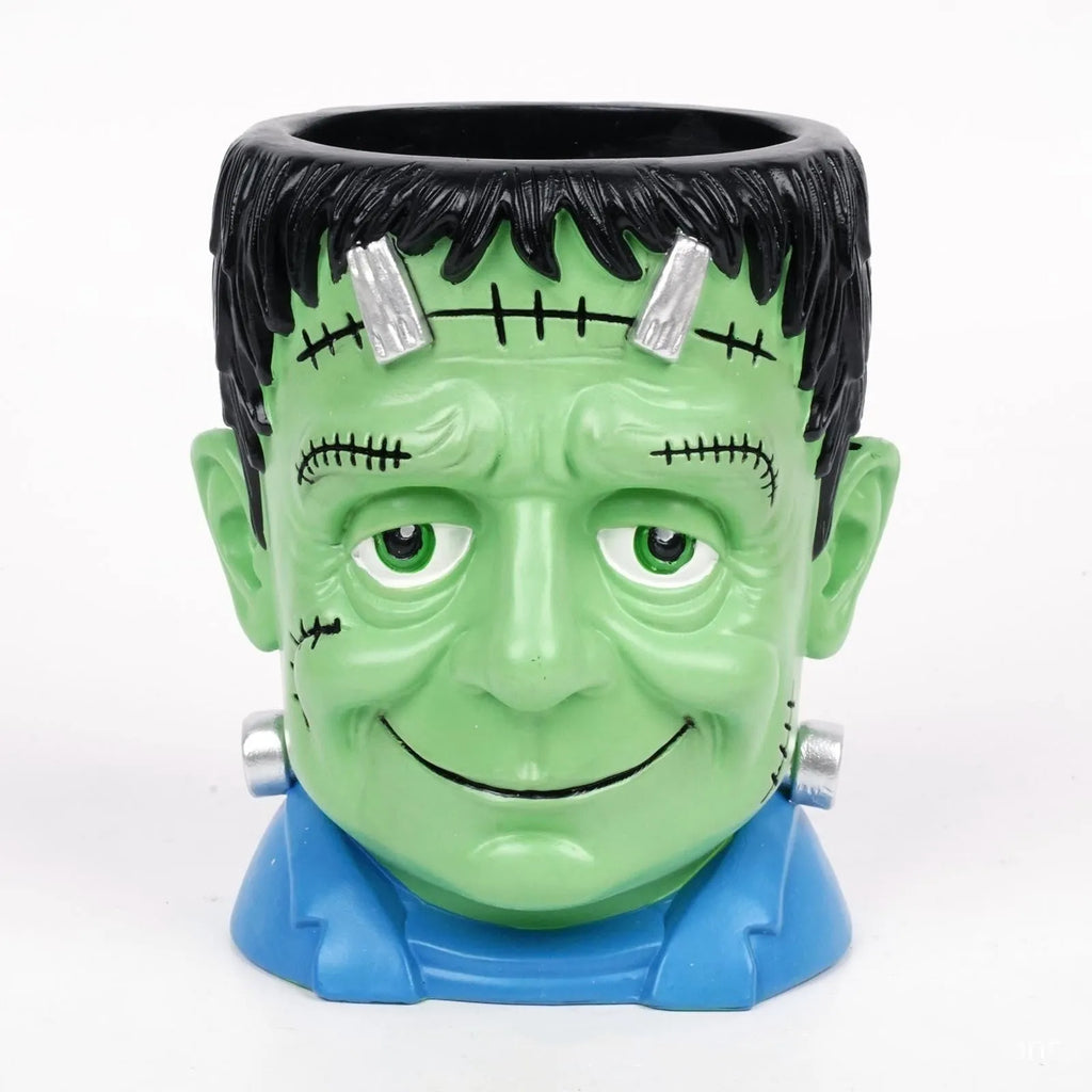 Hand-painted Halloween resin flower pot decorations showing Bandage Zombie, White Ghost, Frankenstein and Death designs.