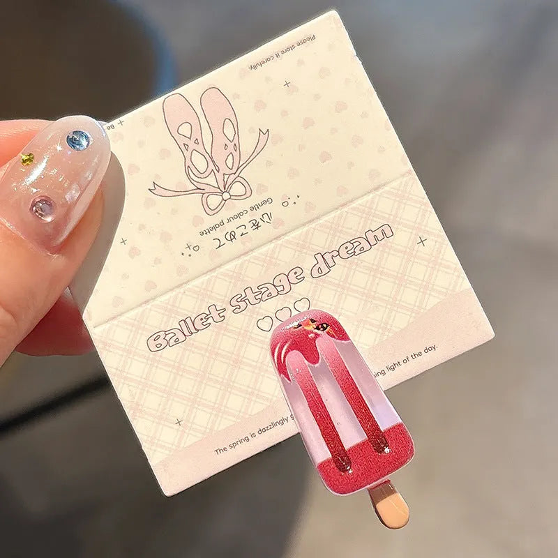 Resin ice cream design hair barrette with side clip fastening.