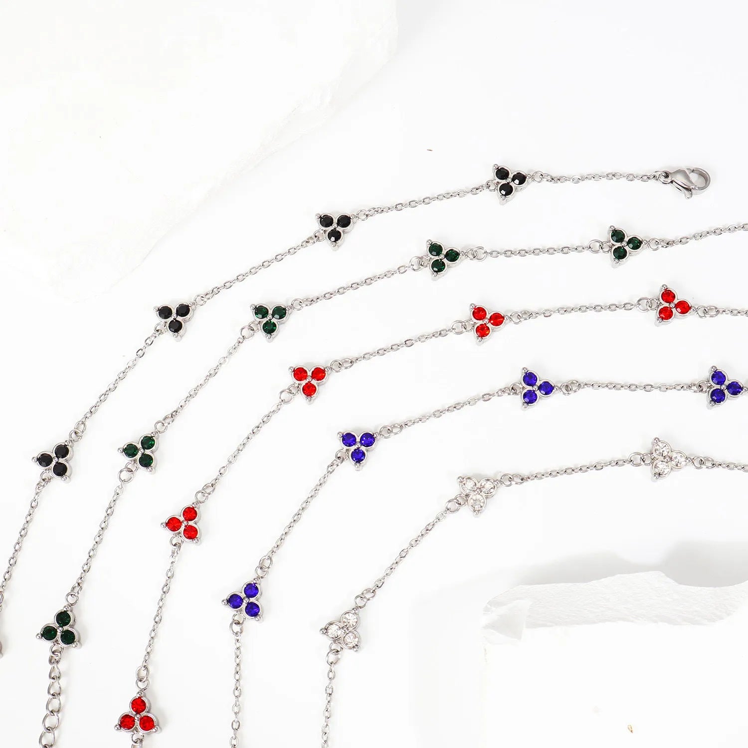 Women's stainless steel bracelet with three geometric diamond designs in various colour options
