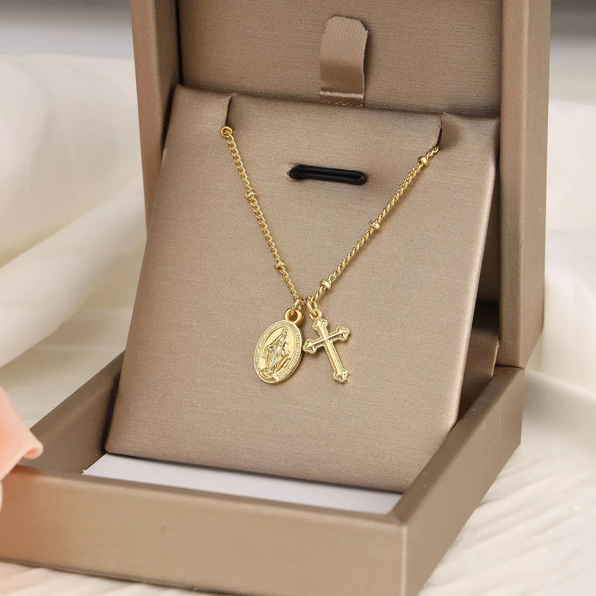 Gold Virgin Mary cross necklace with geometric pendant on 18K copper chain
