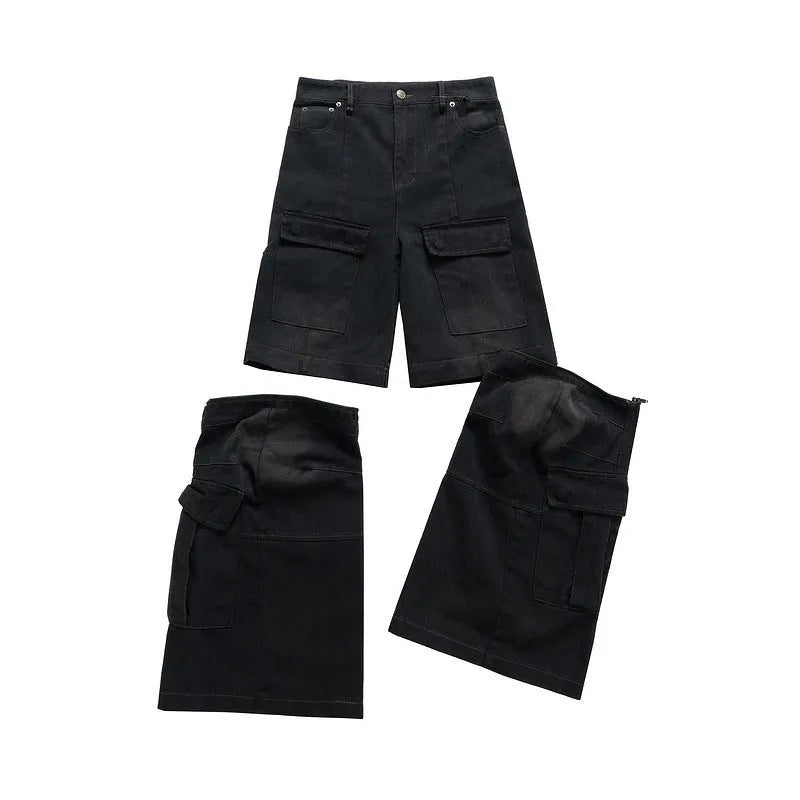 Black washed-out cotton overalls with multiple pockets and a detachable micro-pull design on a hanger.
