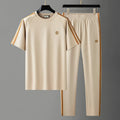 Men's blue ice silk style short sleeve suit set with matching trousers on hanger