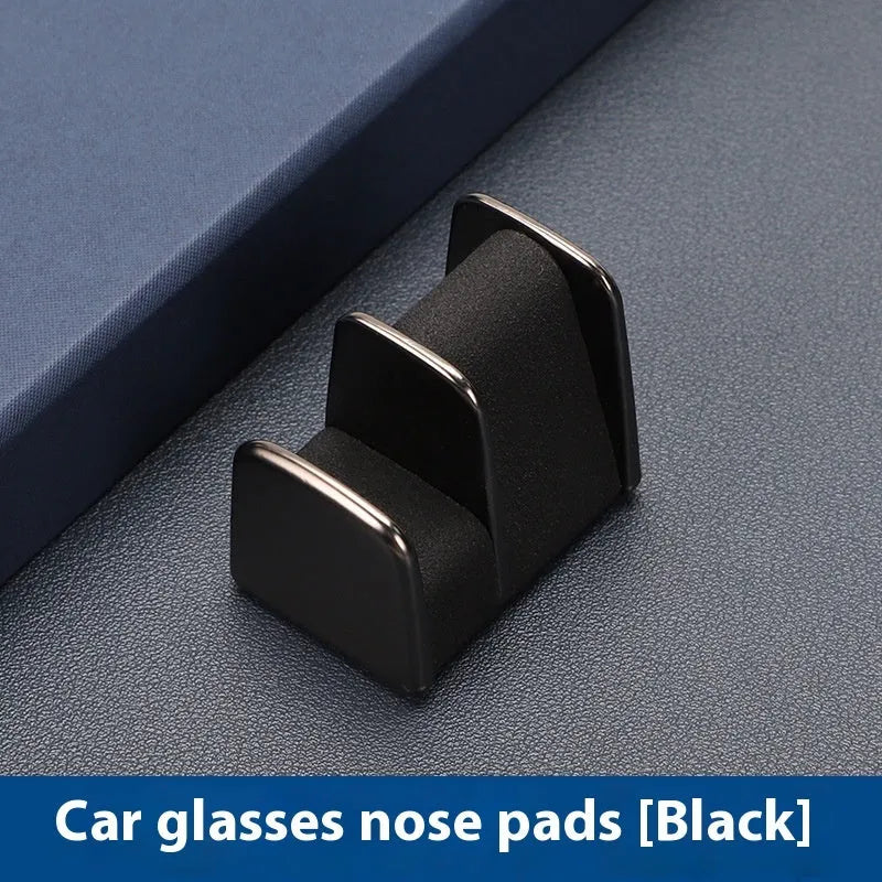 Zinc alloy and leather sunglasses clip for car dashboard in green, black, grey, or red.