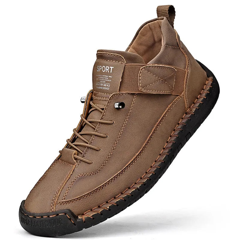 Men's mid-calf black Martin boots with tooling stitching and a flat rubber sole on a white background.