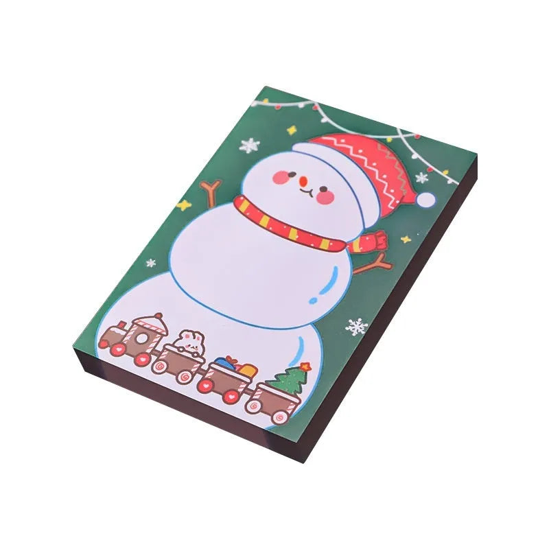 Christmas sticky notes pad showing eight festive designs including Santa Claus, elf, snowman, and gift box