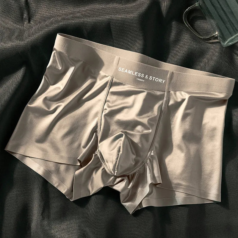 Men's solid colour ice silk nylon underwear in mid waist design on a neutral background.
