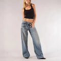 Women's loose straight wide leg cotton trousers in blue colour showing low-waist design and splicing detail