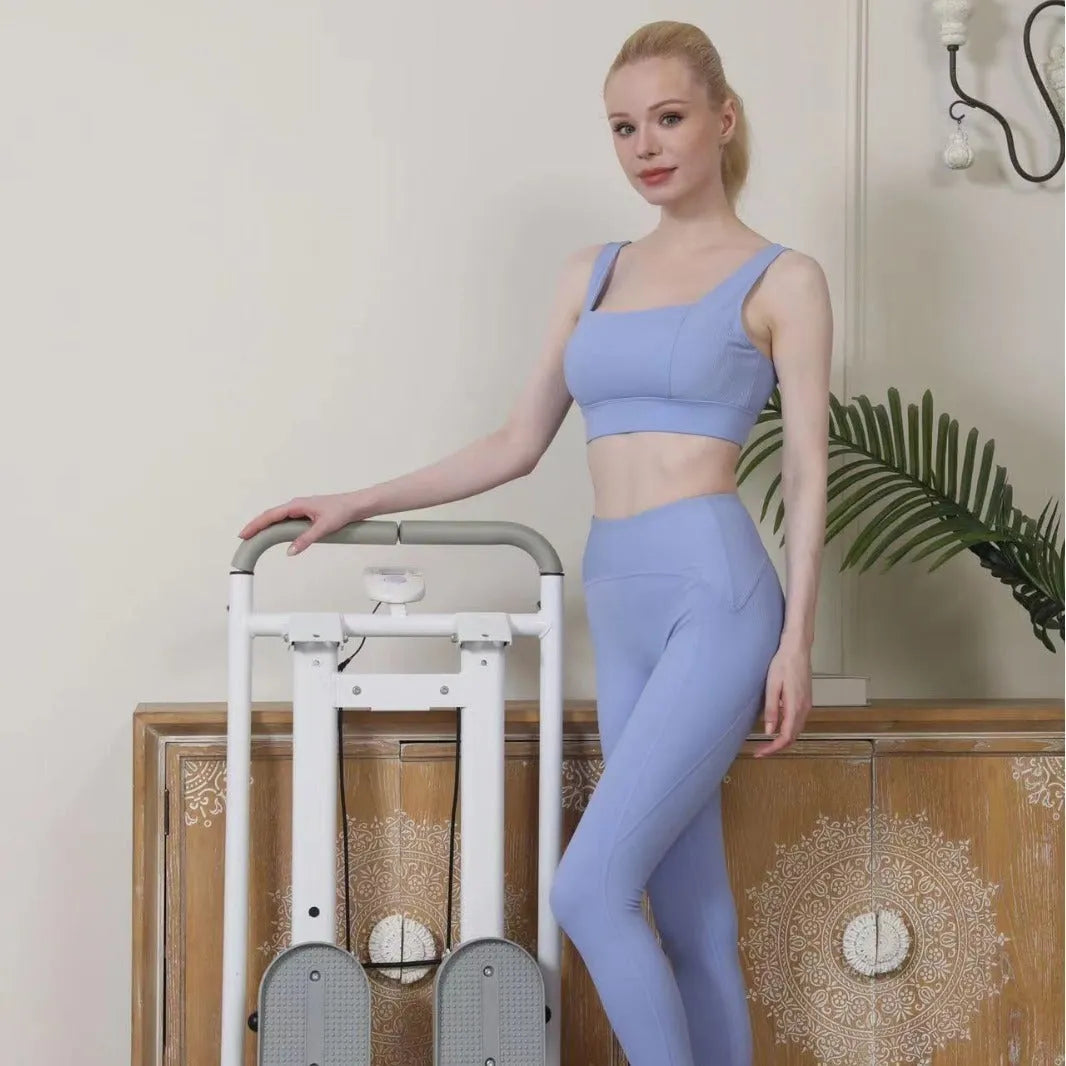 White foldable home treadmill with integrated climbing frame folded for compact storage