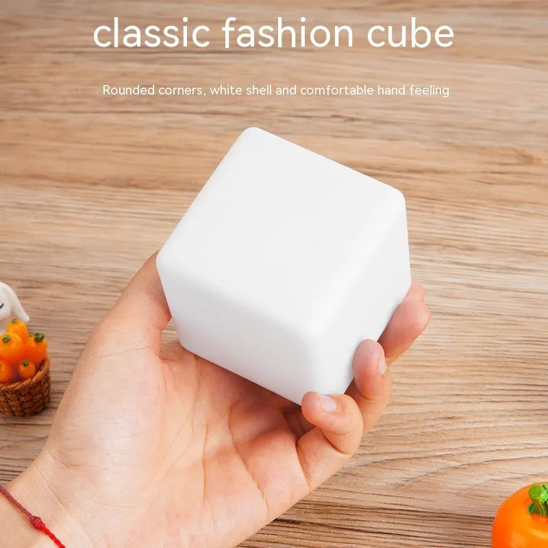 Small square night light showing seven colour changing modes, with remote control.