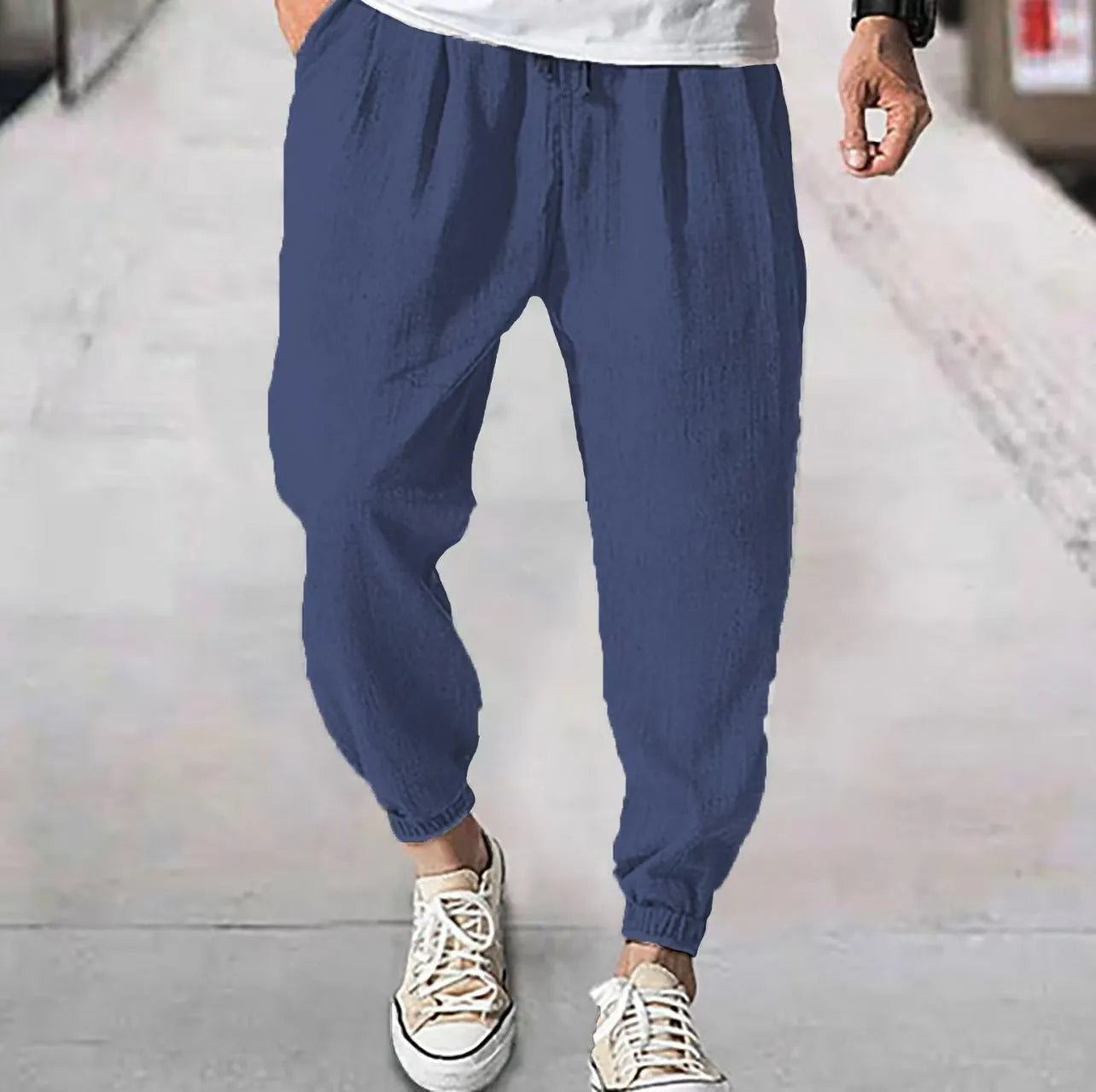 Men's casual cotton trousers with banded ankles in light green colour showing loose fit summer style