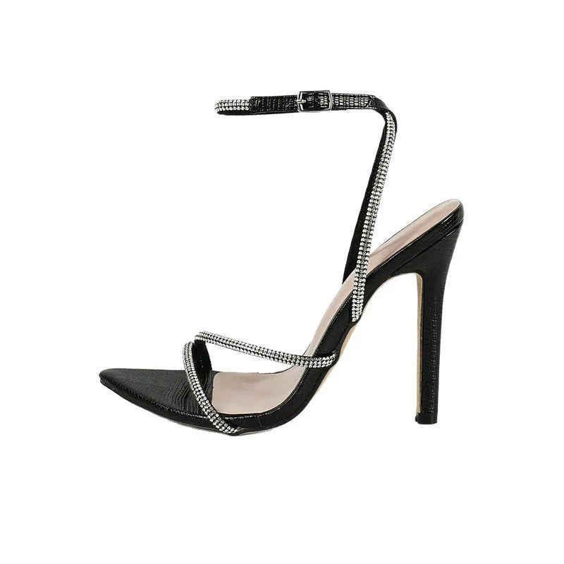 Women's open toe cross strap sandals in black with pointed toe, PU upper, and rubber sole
