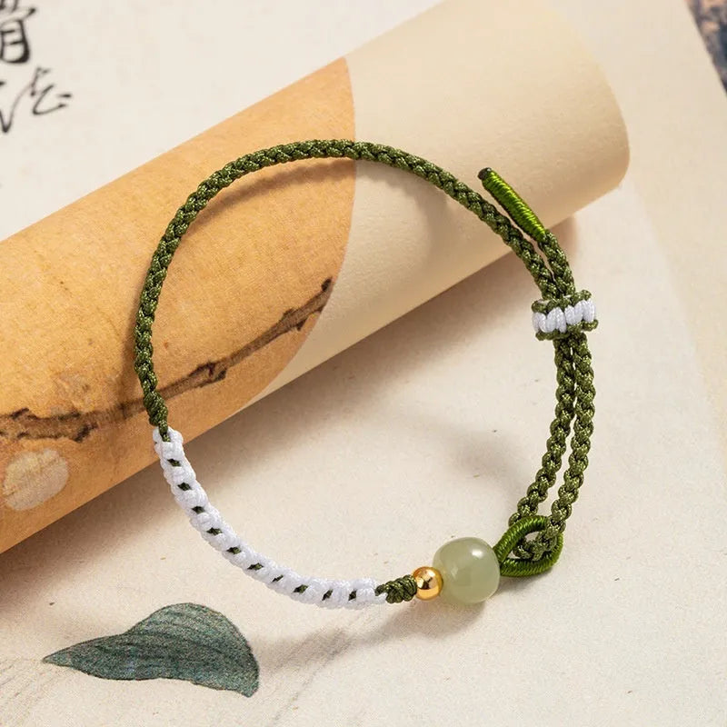 Women's Chinese national bracelet with adjustable cord carrying strap in electroplated finish