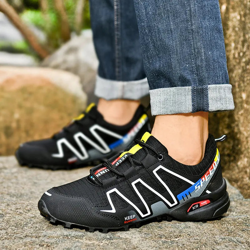 Men's gray orange casual low-top running shoes with synthetic leather upper and rubber sole.