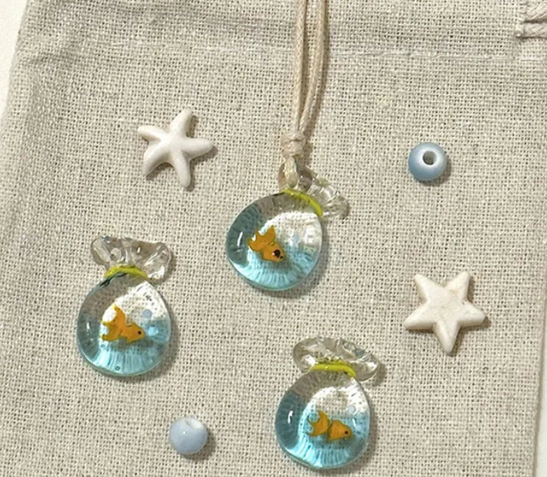 Women's necklace with coloured glaze pendant on a cotton and linen clavicle chain.
