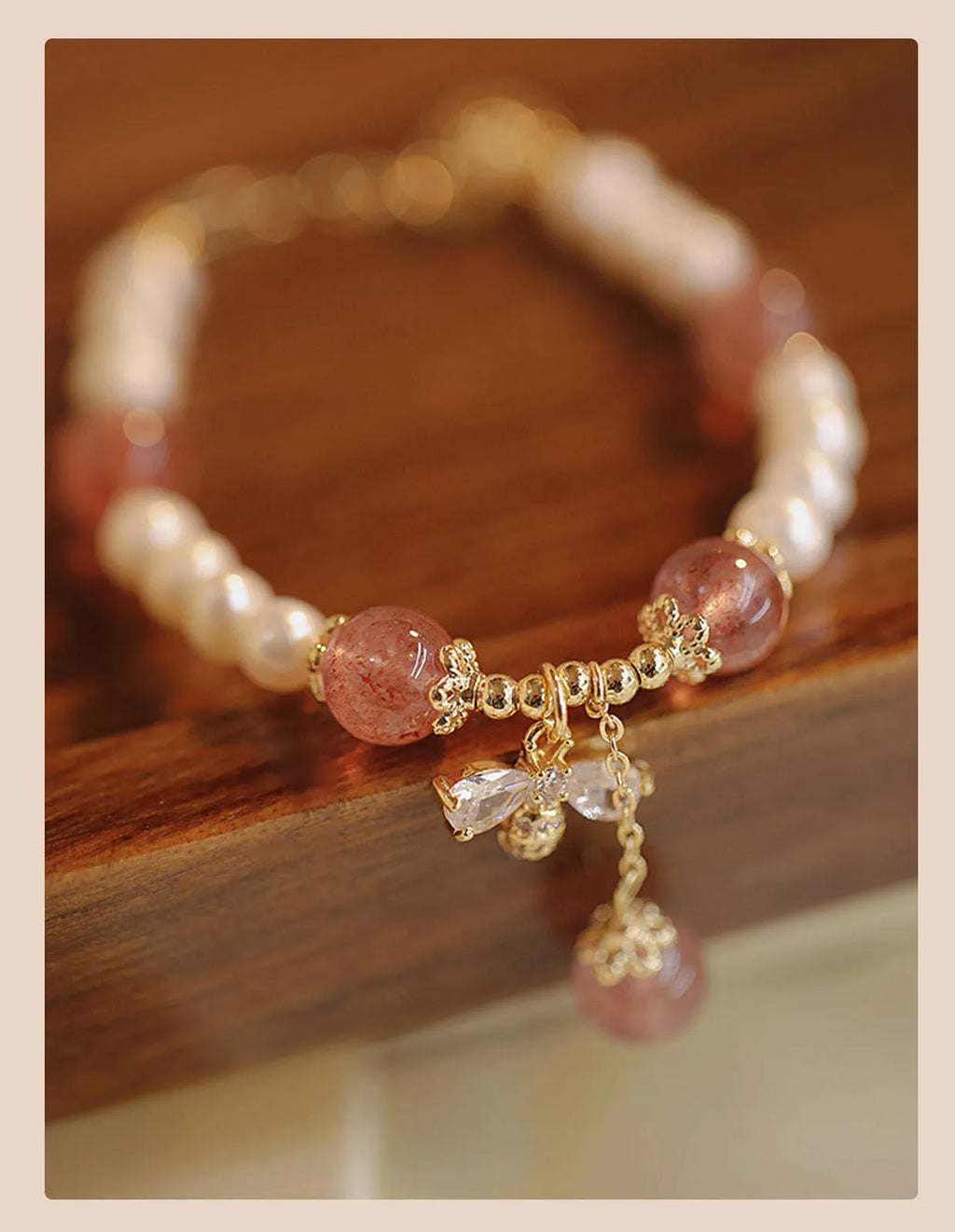 Women's crystal bracelet with strawberry quartz pearls and bow design
