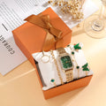 Gold green square women's watch with four matching bracelets showing jewellery buckle and 25mm dial