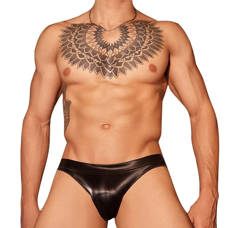 Black and white men's hip-cut briefs made from shark skin lace polyester fabric.