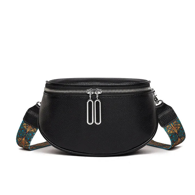 Women's soft PU leather messenger bag in saddle shape with cross-body strap, shown in green colour.
