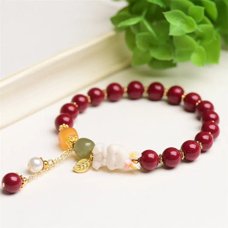 Traditional Chinese cinnabar bracelet with rabbit design, available in 8mm and 10mm bead sizes.