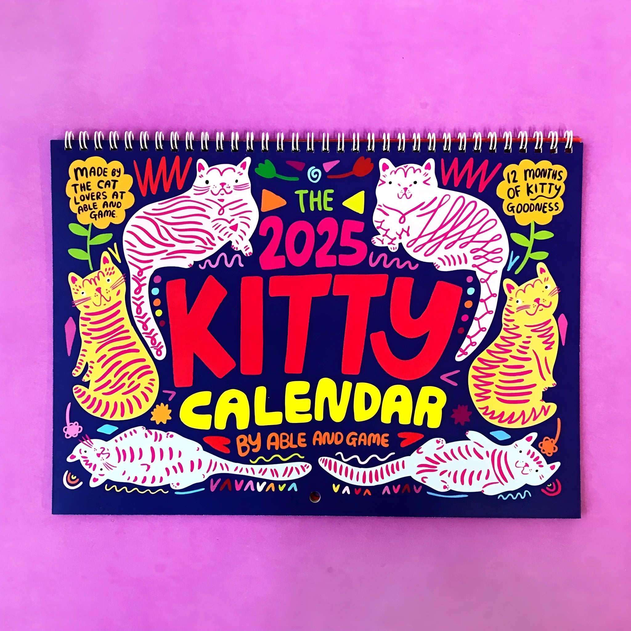 Cat Calendar Wall Planner for 2024 or 2025 with seasonal designs on paper.