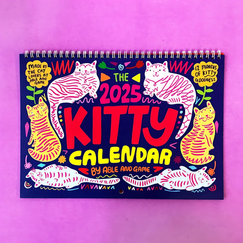 Cat Calendar Wall Planner for 2024 or 2025 with seasonal designs on paper.