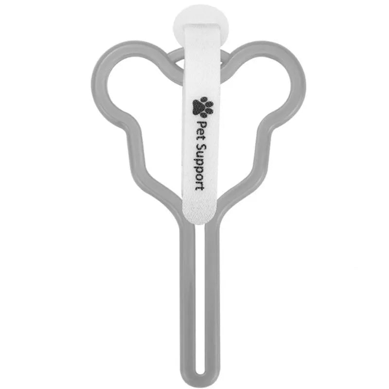 Hands-free dog poop bag holder with black velcro strap and clip attached to a dog leash.