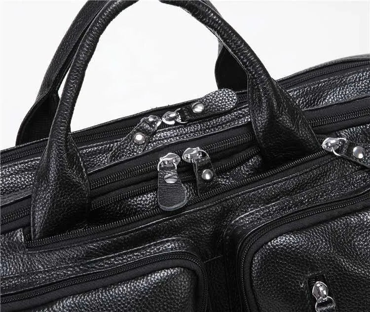 Black large leather handbag horizontal square shape with zipper closure and multiple internal compartments