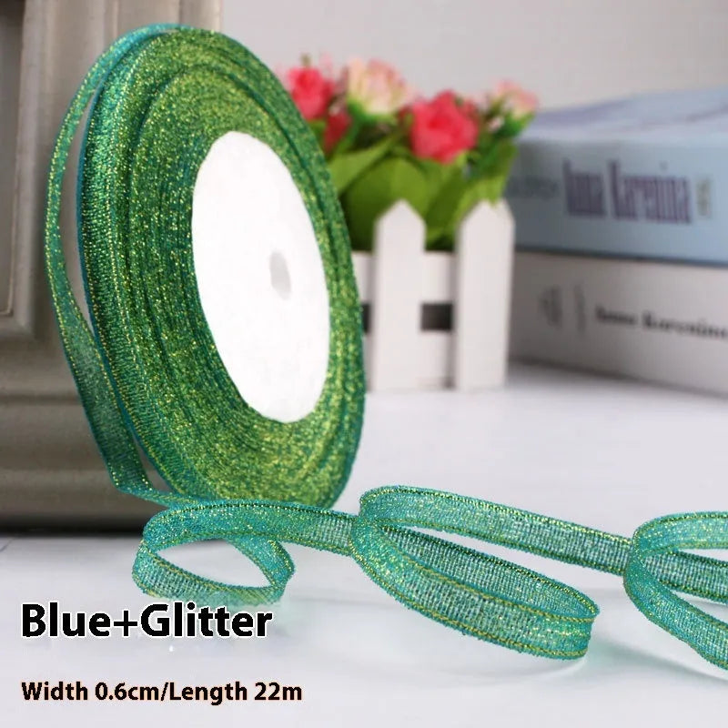 Roll of 0.6cm wide coloured polyester gift ribbon with 22 metre length.