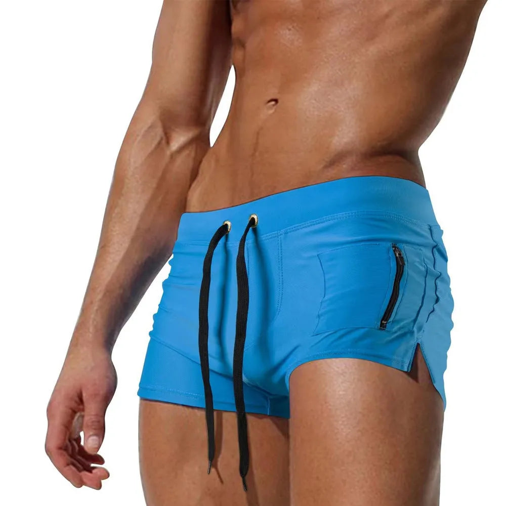 Men's black high-waist swimming trunks with a lace-up front, made from polyester and spandex.