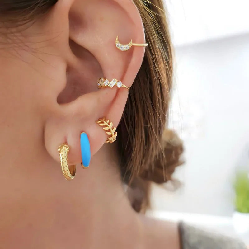 Oval curved women's earrings with colourful epoxy drip coating in geometric U-shape design.