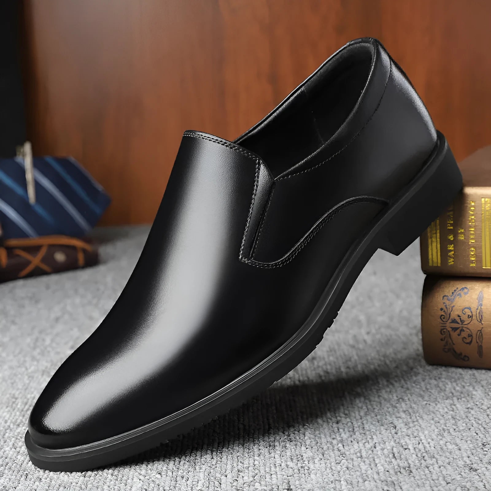 Men's black business casual slip-on shoes with leather toe cap and rubber sole