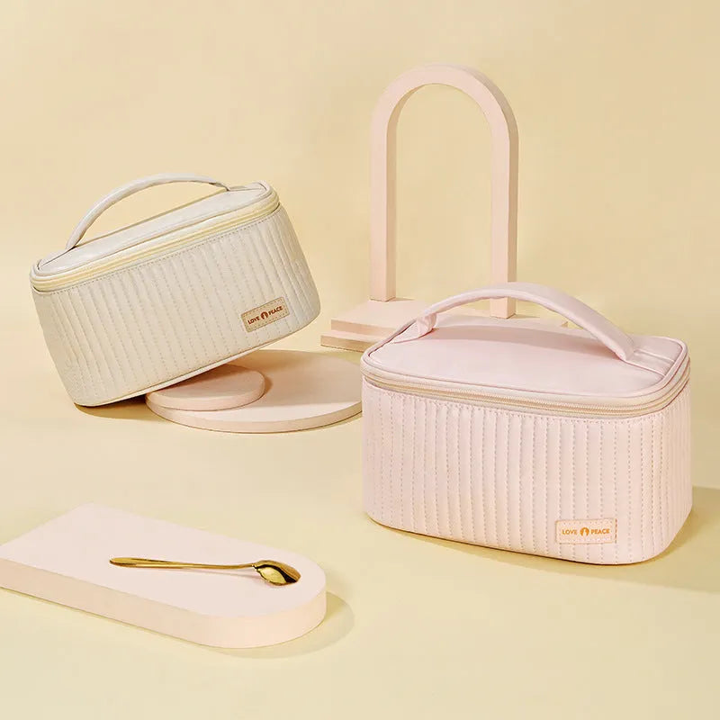 Open-top PU leather makeup bag in a choice of six solid colours including pink, coffee, and light blue.