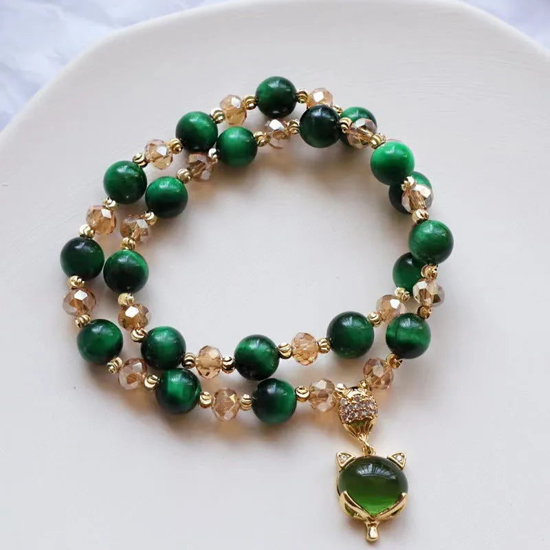 Handmade natural Tigereye stone bracelet with Vanves stone centre, shown in single and double chain designs.