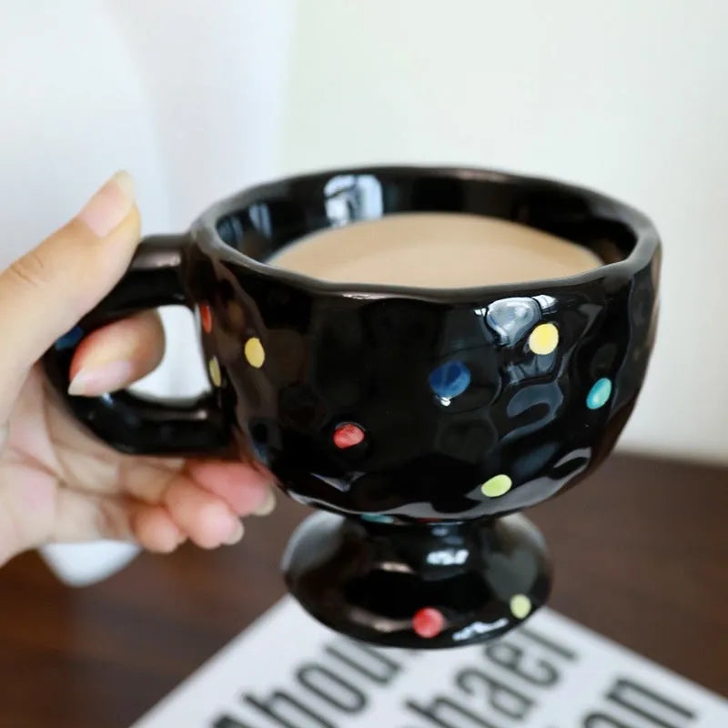 Hand-pinched irregular shaped ceramic mug in solid colour with modern simplicity design