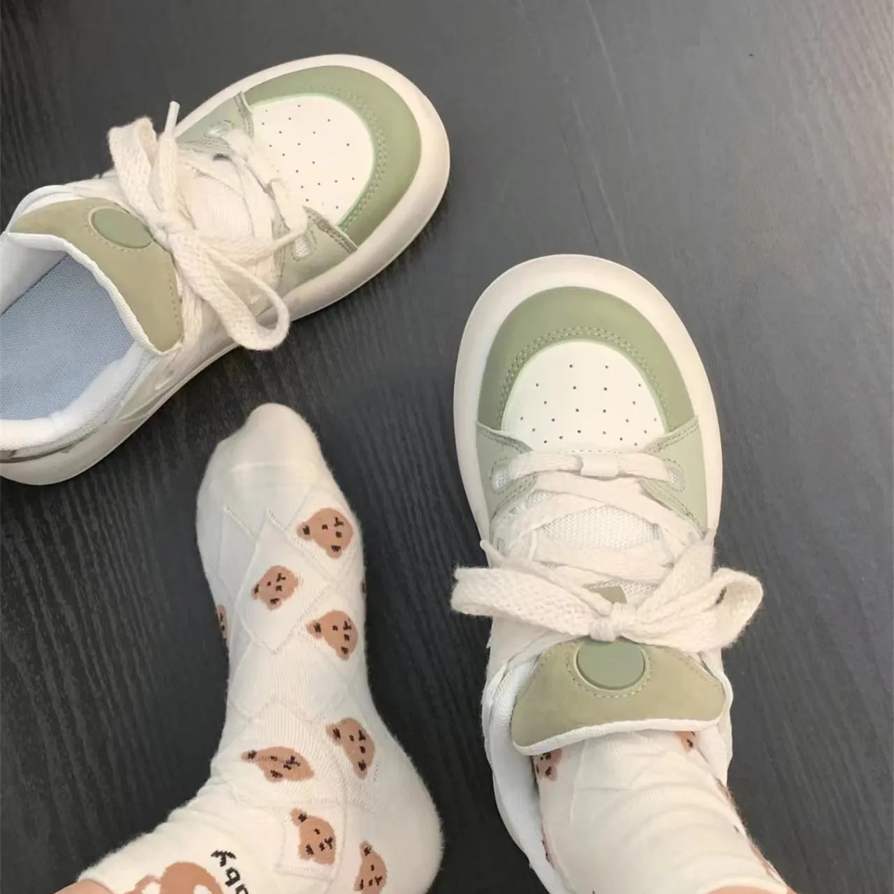 Women's green casual shoes with mesh upper, flat heel, and round toe design