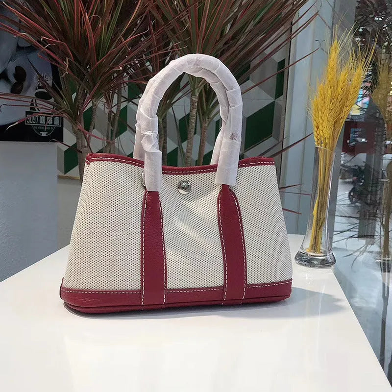 Genuine leather women's crossbody tote bag with canvas texture in bucket shape