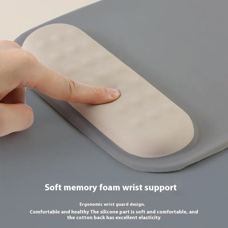 Ergonomic cloth silicone mouse pad with raised wrist support in mint green colour.