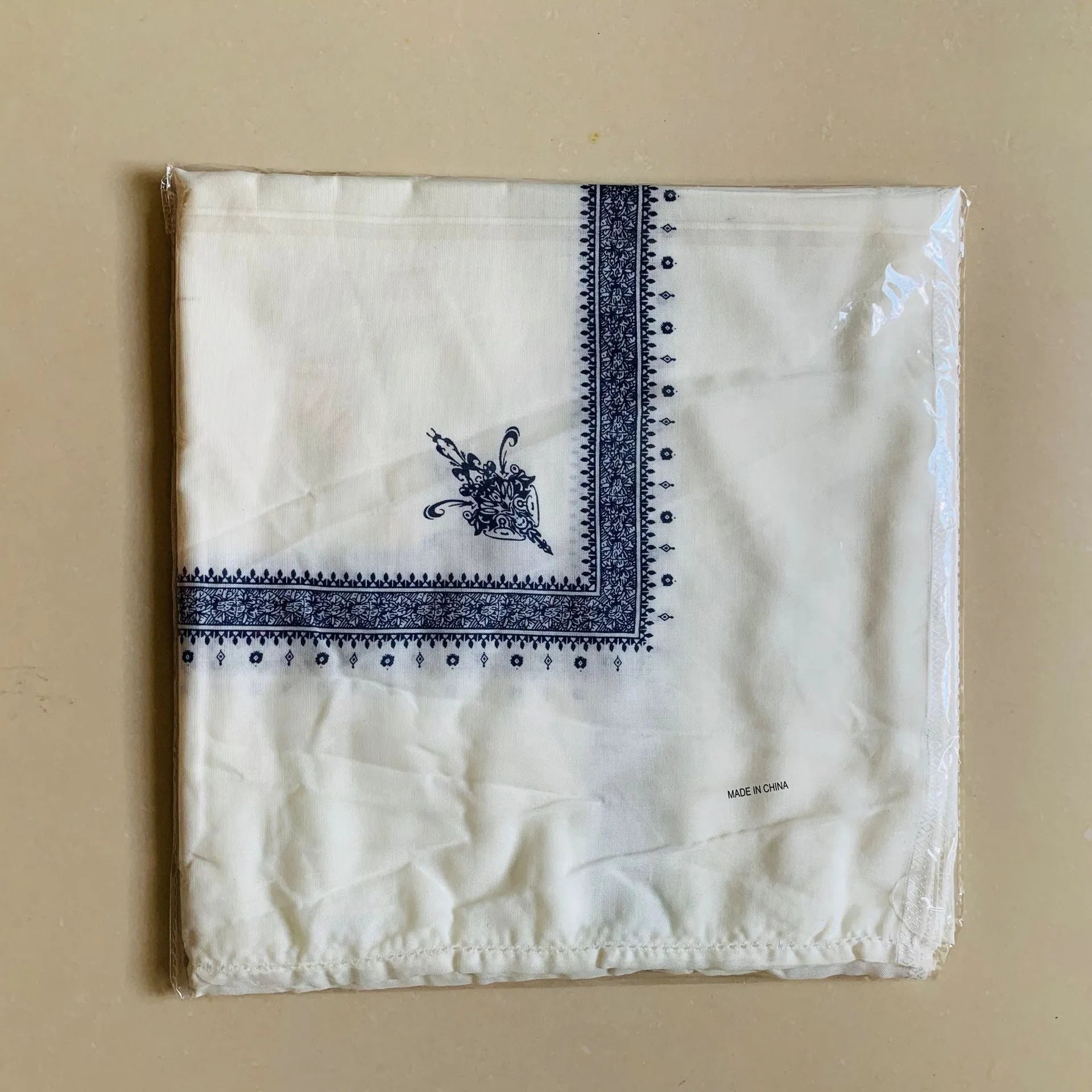 Printed square polyester scarf showing coffee colour option laid flat to display 138cm dimensions