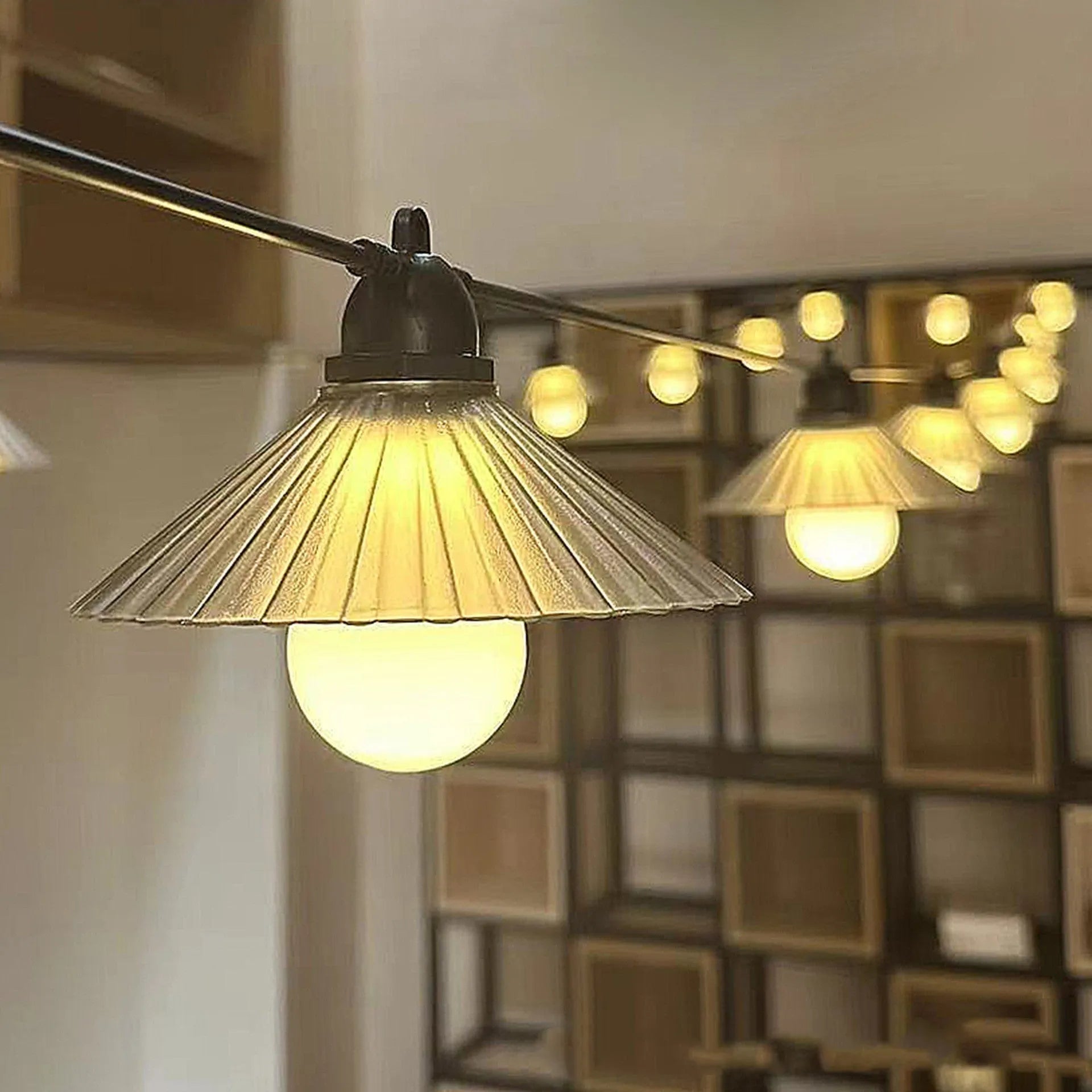 Outdoor LED string lights with flower-shaped bulbs in warm white and multicolour settings.