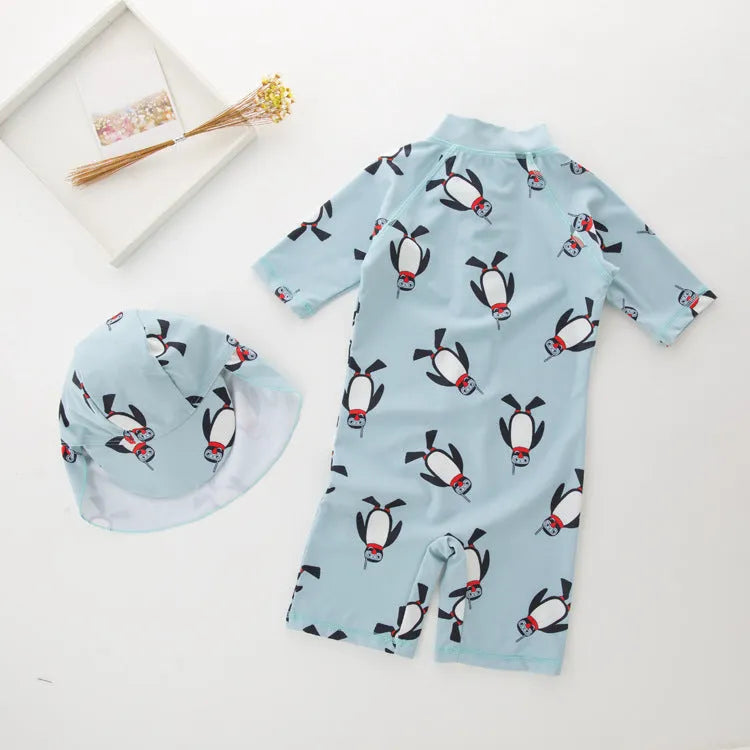 Boy's penguin print swim set with long sleeves and matching swimming cap for ages 2-7 years