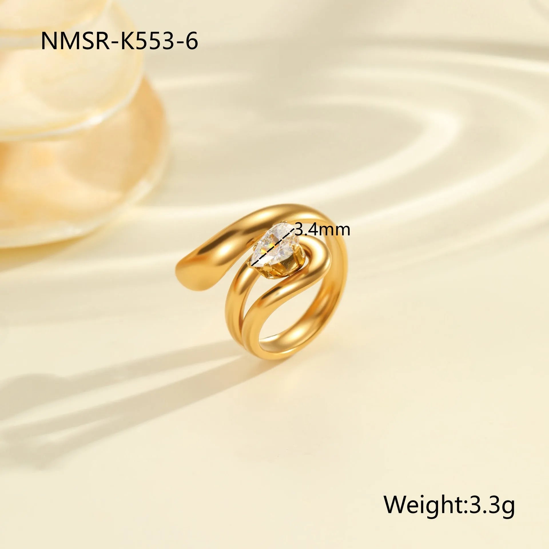 Geometric stainless steel zircon ring with open mouth design on a hand.