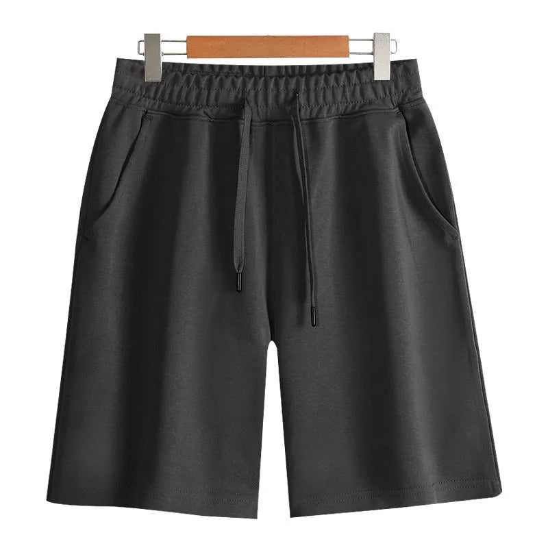 Cotton straight-leg summer shorts in light grey shown on a hanger