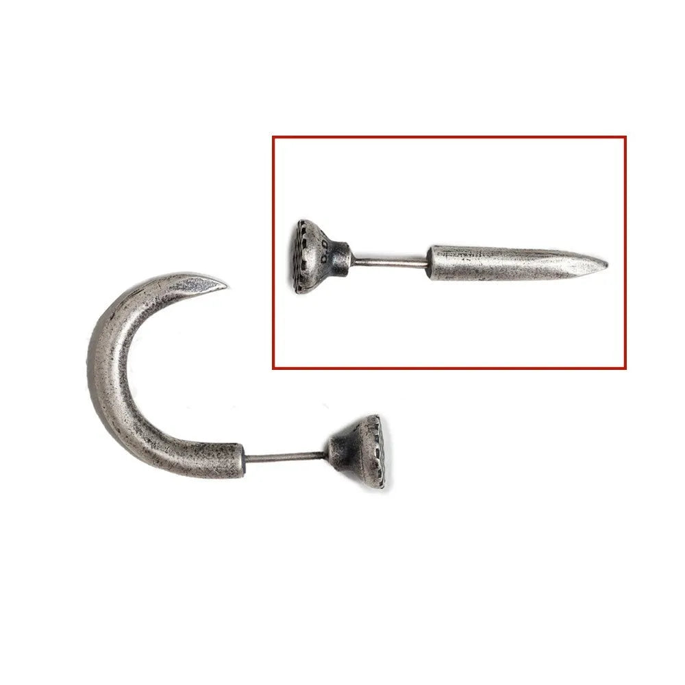 Close-up of a sterling silver S925 punk-style earring shaped like a retro nail, shown on a hook back.
