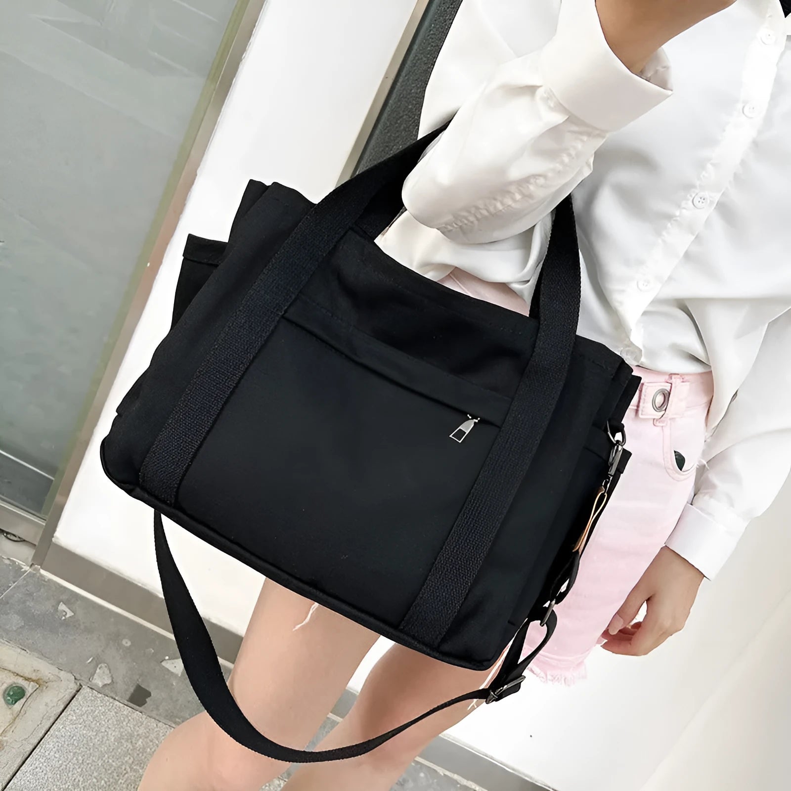 Canvas tote bag showing multiple internal compartments and both sides zipper openings in horizontal square shape