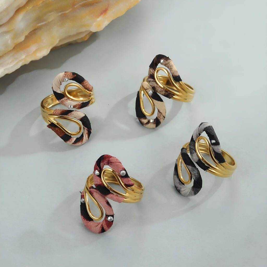 Stainless steel open mouth ring with leopard print in geometric shape on a hand.