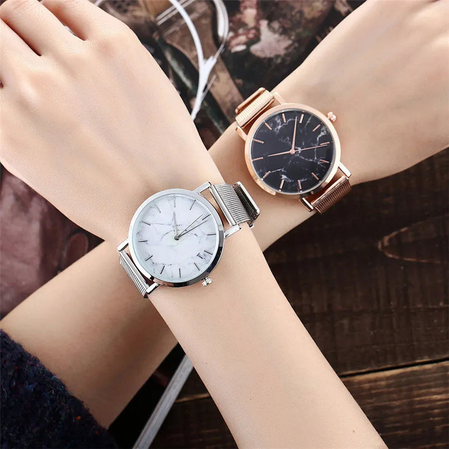 Vansvar women's quartz watch with silver mesh band and marble dial